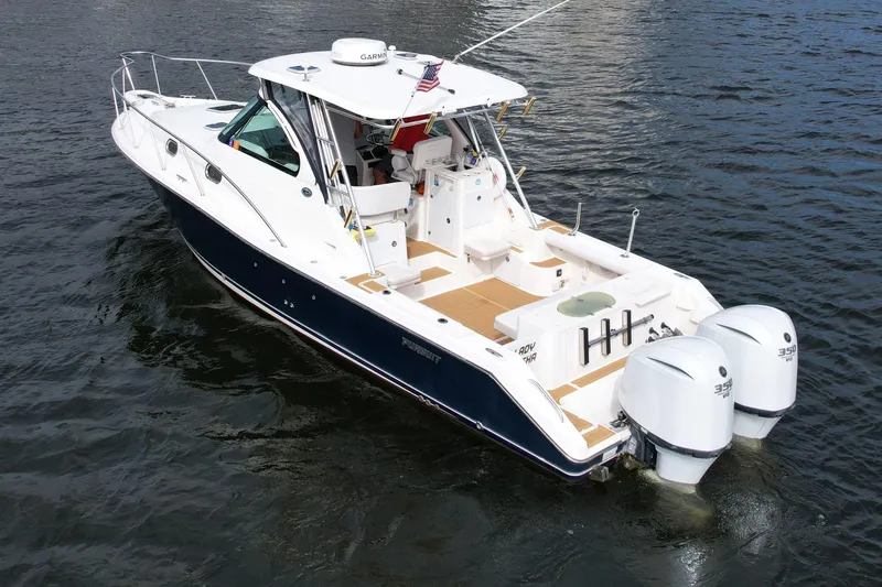Slide: The Image of 2008 Pursuit OS 335 Offshore boat with dual engines on water. - 2