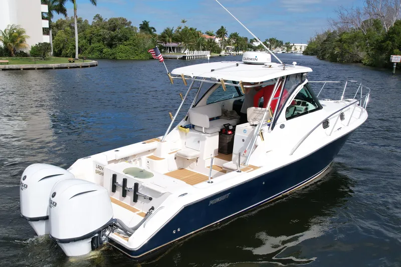 Slide: The Image of 2008 Pursuit OS 335 Offshore boat cruising on a scenic waterway. - 3