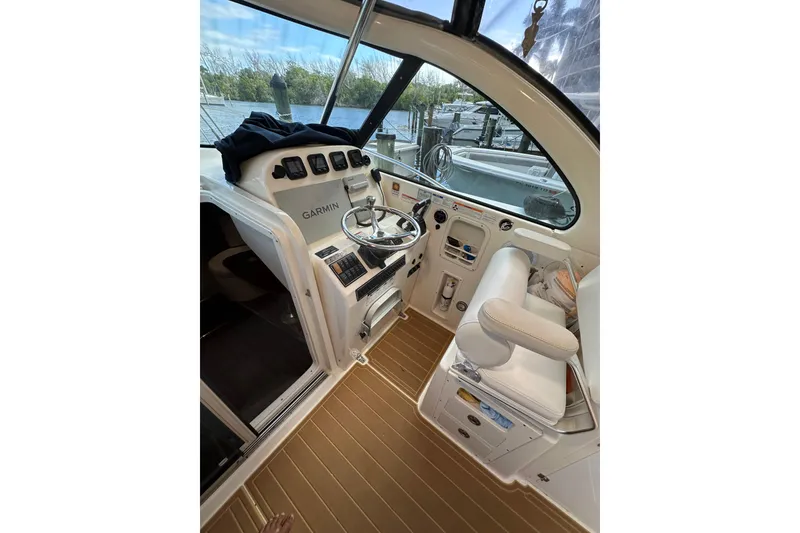 Slide: The Image of 2008 Pursuit OS 335 Offshore boat cockpit with Garmin navigation system and comfortable seating. - 36