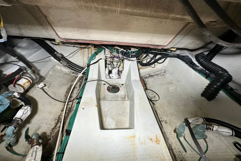 Slide: The Image of Engine compartment of a 2008 Pursuit OS 335 Offshore boat, showing wiring and components. - 39