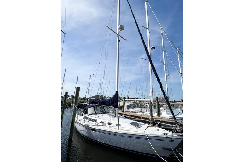 The Image of 2003 Catalina 34 MkII sailboat docked at marina under clear blue sky. - 1