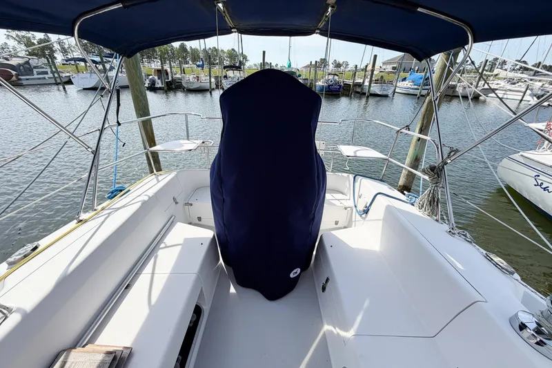 Slide: The Image of Cockpit view of a 2003 Catalina 34 MkII sailboat docked at a marina. - 12