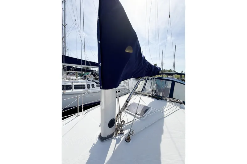 Slide: The Image of 2003 Catalina 34 MkII sailboat deck with covered mainsail and rigging. - 16