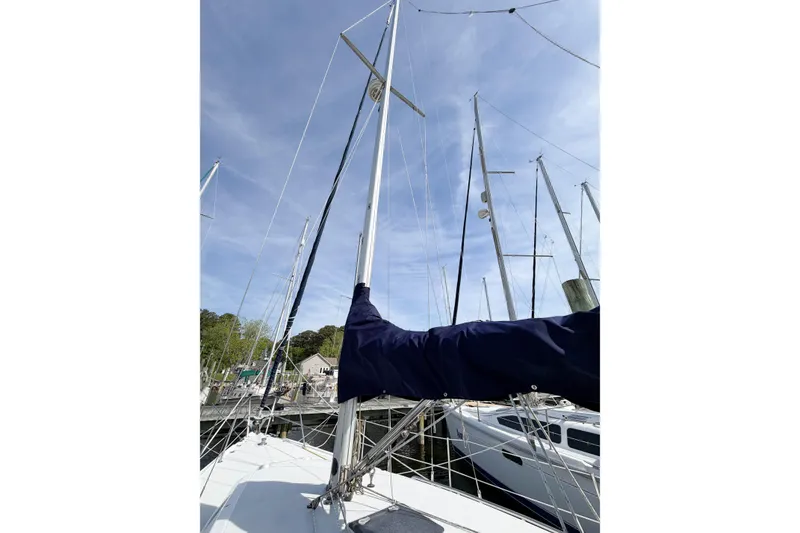 Slide: The Image of 2003 Catalina 34 MkII sailboat mast and rigging at marina under blue sky. - 17