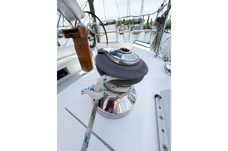 Slide: The Image of Winch with rope on 2003 Catalina 34 MkII sailboat deck, marina in background. - 18