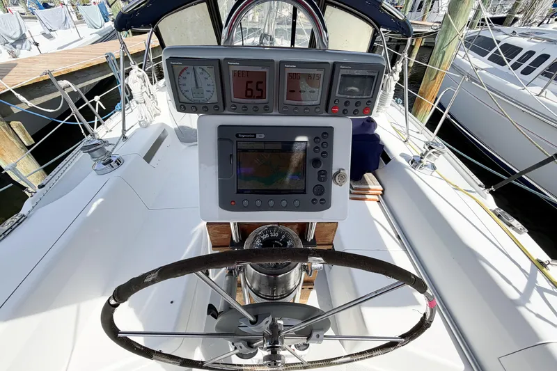 Slide: The Image of Cockpit of 2003 Catalina 34 MkII sailboat with navigation instruments and steering wheel. - 21