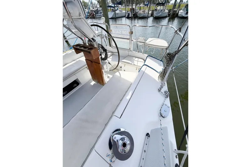 Slide: The Image of Cockpit view of 2003 Catalina 34 MkII sailboat, featuring steering wheel and seating area. - 25