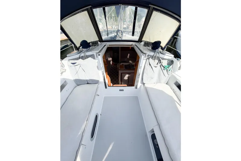 Slide: The Image of 2003 Catalina 34 MkII sailboat cockpit with open cabin entrance and seating. - 28