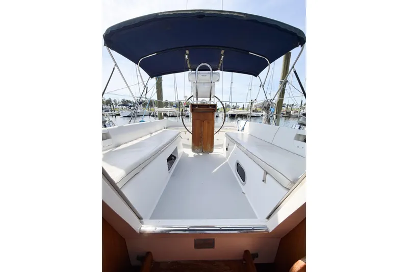 Slide: The Image of Cockpit of 2003 Catalina 34 MkII sailboat with blue canopy and white seating. - 30