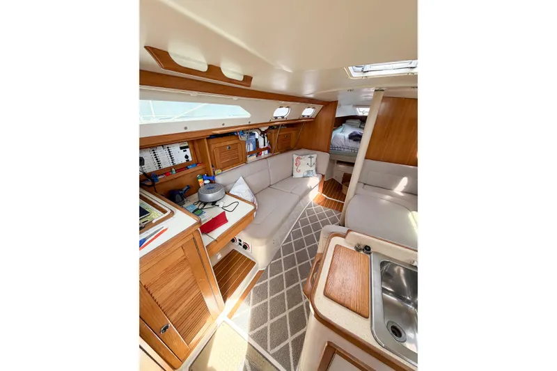 Slide: The Image of Interior of 2003 Catalina 34 MkII sailboat with cozy seating and wooden cabinetry. - 35
