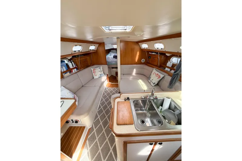 Slide: The Image of Interior of 2003 Catalina 34 MkII sailboat with cozy seating and kitchenette. - 36