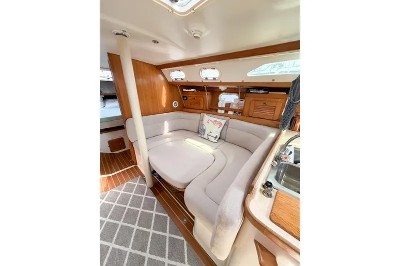 Slide: The Image of Interior of 2003 Catalina 34 MkII sailboat with cozy seating and wooden accents. - 40