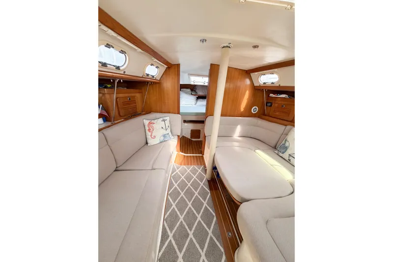 Slide: The Image of Interior of 2003 Catalina 34 MkII sailboat with cozy seating and nautical decor. - 41