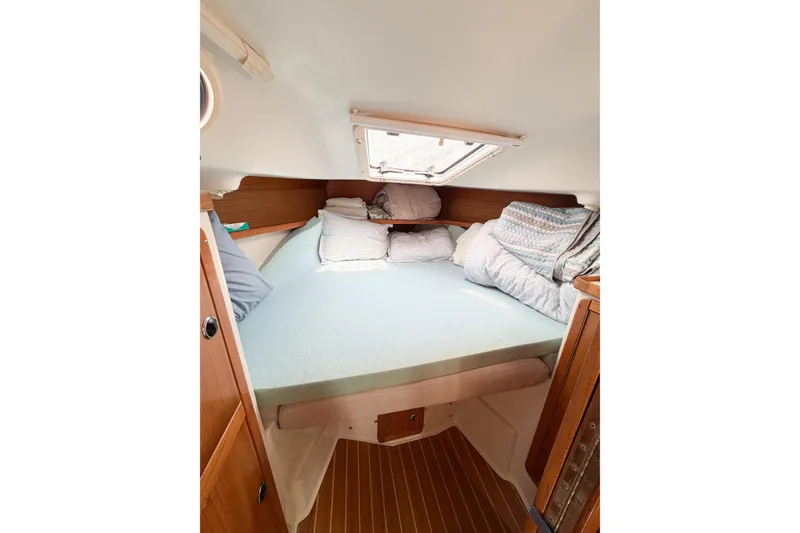 Slide: The Image of Cozy cabin interior of 2003 Catalina 34 MkII sailboat with comfortable bedding. - 43