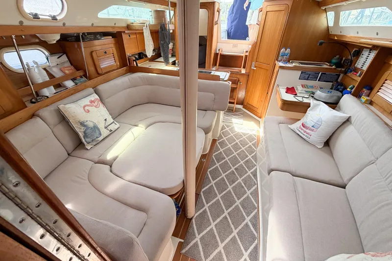 Slide: The Image of Interior of 2003 Catalina 34 MkII sailboat with cozy seating and wooden cabinetry. - 46