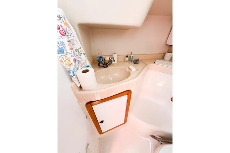 Slide: The Image of Compact bathroom in 2003 Catalina 34 MkII sailboat with sink and storage cabinet. - 53