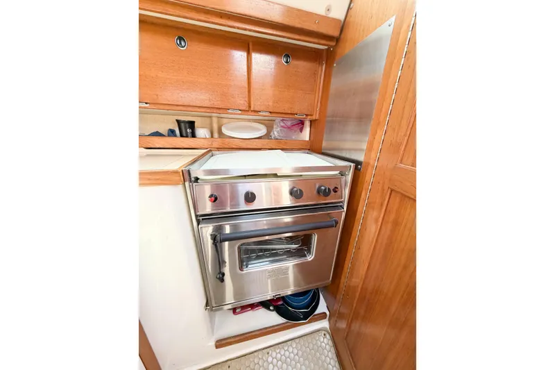 Slide: The Image of Galley kitchen in 2003 Catalina 34 MkII sailboat with stainless steel oven. - 55