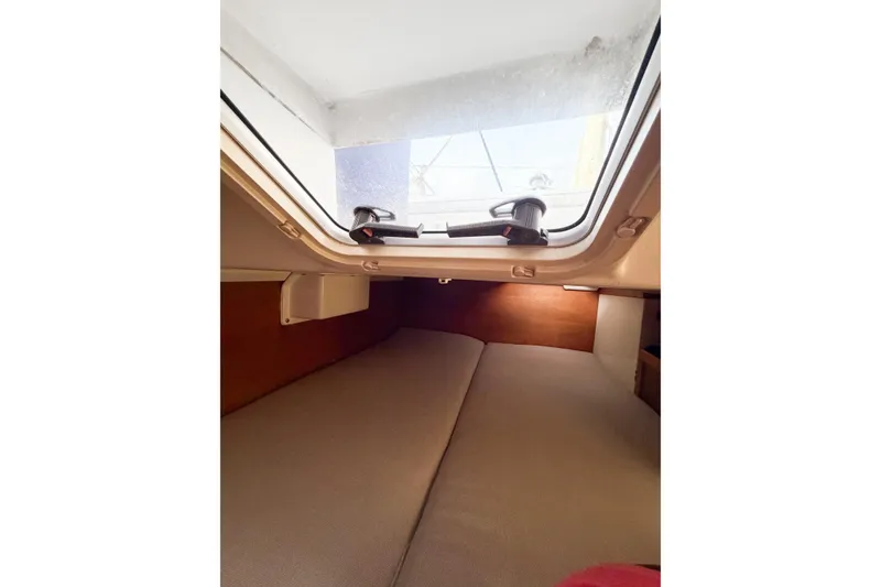 Slide: The Image of Interior cabin view of a 2003 Catalina 34 MkII sailboat, featuring a cozy sleeping area. - 56