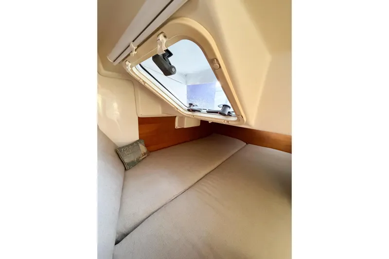 Slide: The Image of Cozy cabin interior of 2003 Catalina 34 MkII sailboat with open porthole. - 57