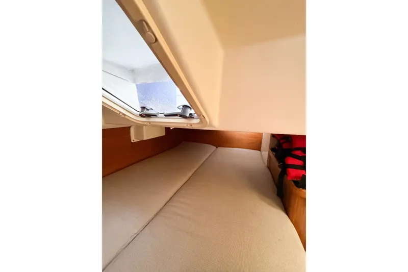 Slide: The Image of Interior cabin of 2003 Catalina 34 MkII sailboat with open hatch and cozy bedding. - 58