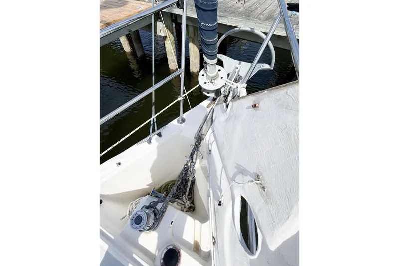 Slide: The Image of 2003 Catalina 34 MkII sailboat bow with anchor chain and winch. - 69