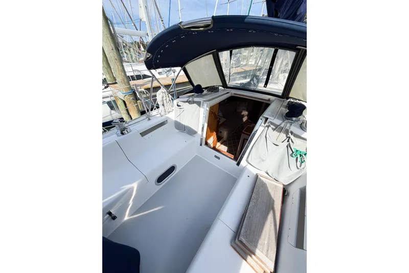 Slide: The Image of 2003 Catalina 34 MkII sailboat cockpit with open cabin entrance, docked at marina. - 8