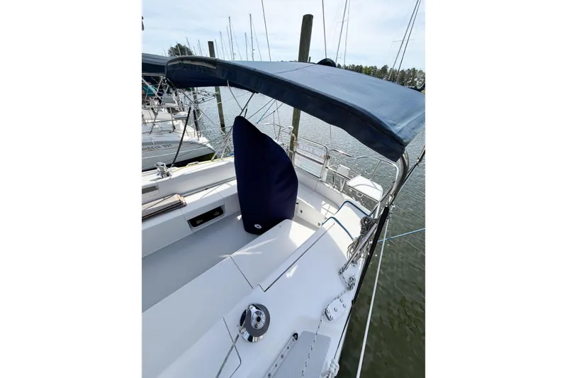 Slide: The Image of 2003 Catalina 34 MkII sailboat cockpit with blue canopy, docked at marina. - 9