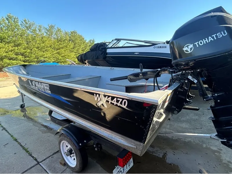Slide: The Image of Black Lowe WV1470 boat from 2021 with Tohatsu motor. - 4