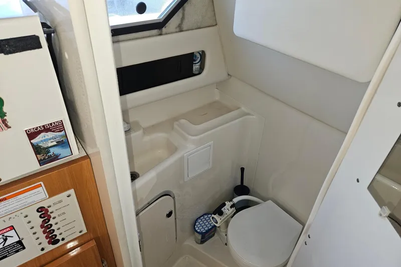 Slide: The Image of 2002 Bayliner 2859 Ciera Classic boat bathroom interior with toilet and sink. - 10