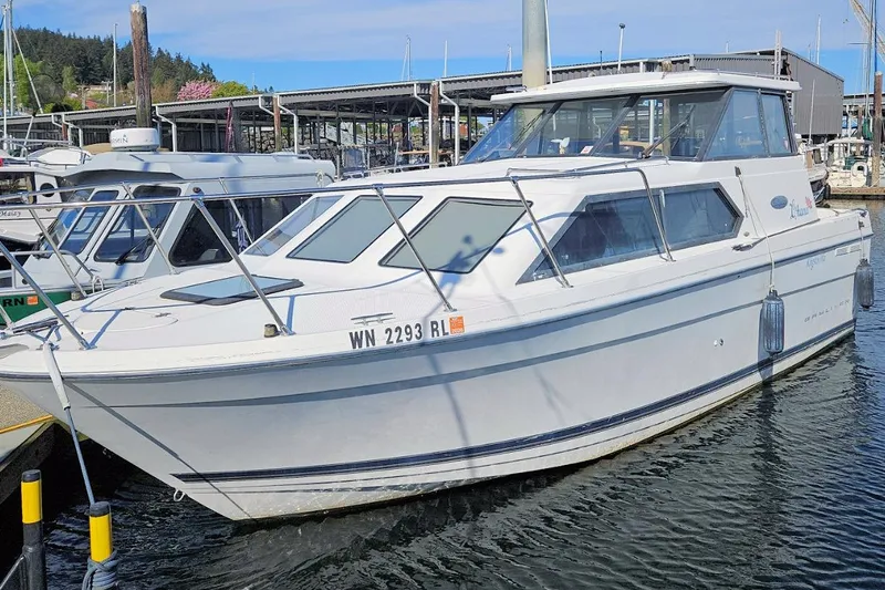 Slide: The Image of 2002 Bayliner 2859 Ciera Classic boat docked at a marina. - 2