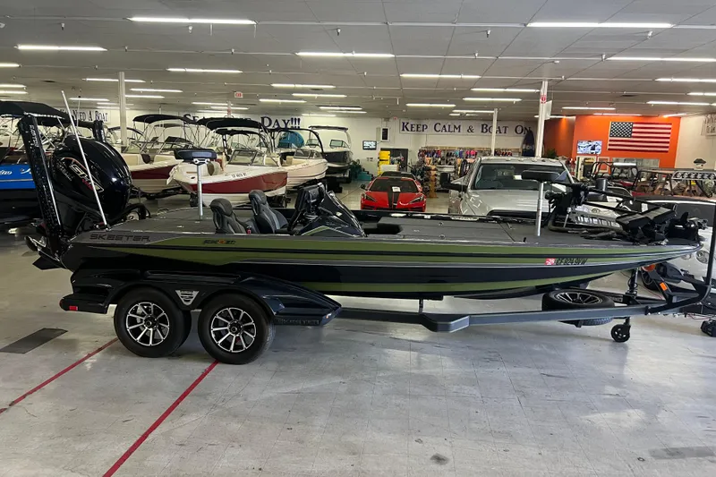 The Image of 2024 Skeeter FXR21 Apex boat on trailer, parked outdoors. - 0