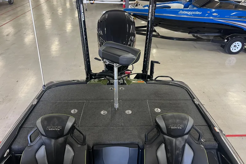 Slide: The Image of 2024 Skeeter FXR21 Apex fishing boat deck with advanced equipment and seating. - 11