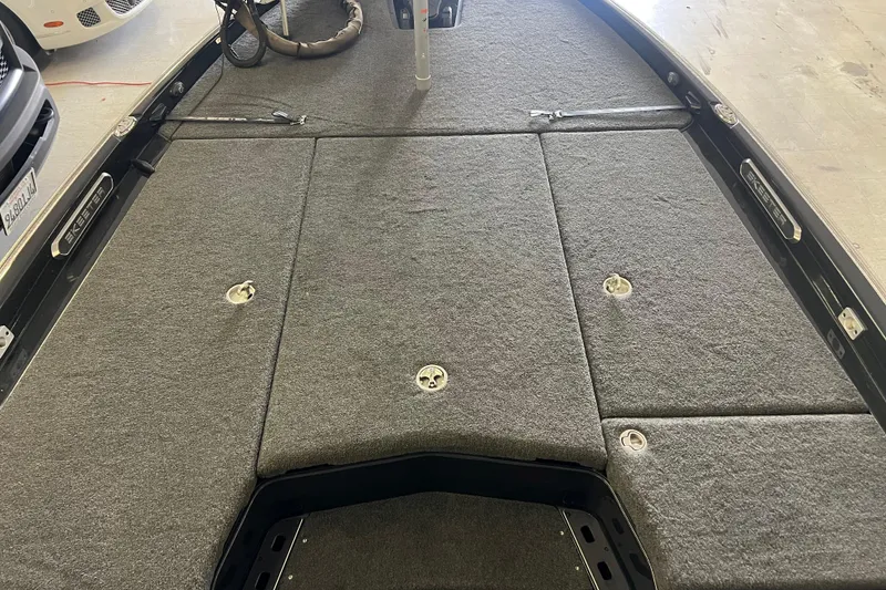 Slide: The Image of 2024 Skeeter FXR21 Apex boat with Minn Kota trolling motor, close-up view. - 12