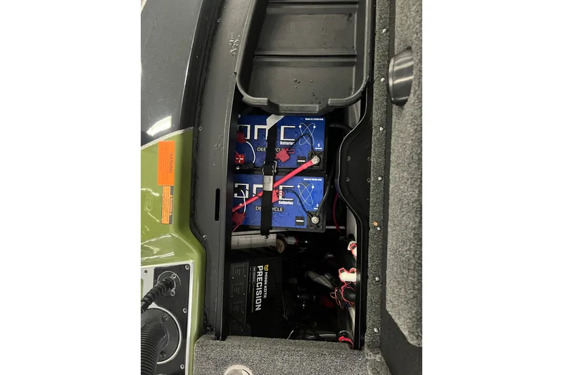 Slide: The Image of 2024 Skeeter FXR21 Apex boat interior with open storage compartments. - 18