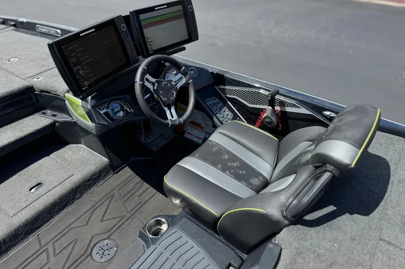 Slide: The Image of 2024 Skeeter FXR21 Apex boat cockpit with dual screens and ergonomic seating. - 29