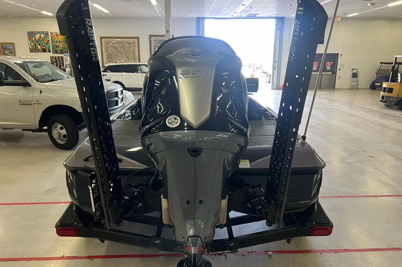 Slide: The Image of 2024 Skeeter FXR21 Apex boat with Minn Kota Ultrex motor, parked on a trailer. - 3