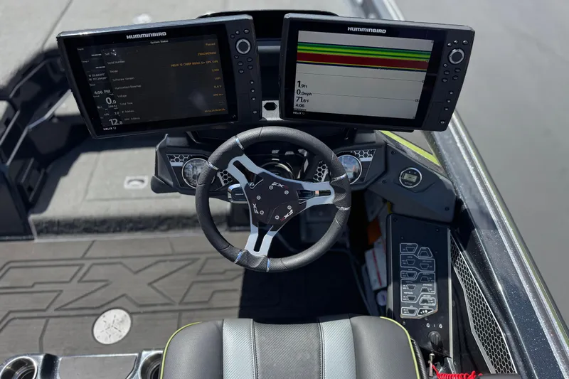 Slide: The Image of 2024 Skeeter FXR21 Apex boat dashboard with dual Humminbird displays and steering wheel. - 30