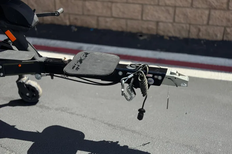 Slide: The Image of Trailer hitch of 2024 Skeeter FXR21 Apex boat on pavement. - 37