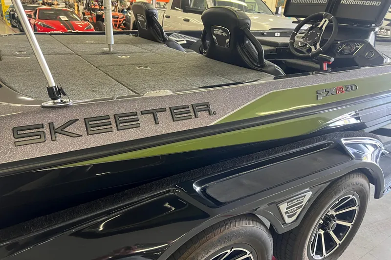 Slide: The Image of 2024 Skeeter FXR21 Apex with Yamaha SHO VMAX engine, parked outdoors. - 6