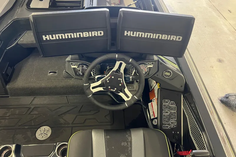 Slide: The Image of 2024 Skeeter FXR21 Apex boat with Yamaha 250 engine, outdoors under cloudy sky. - 7