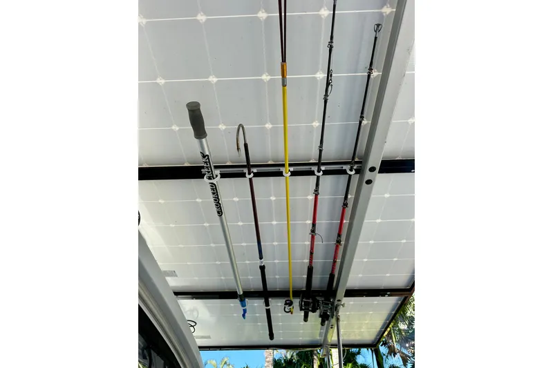 Slide: The Image of Fishing rods stored on a 2016 Lagoon 450 S catamaran's ceiling rack. - 102