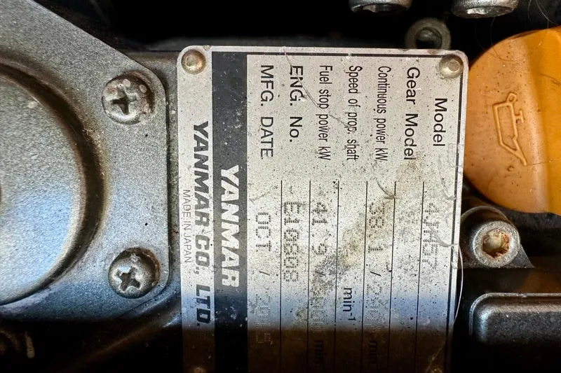 Slide: The Image of Yanmar engine plate on a 2016 Lagoon 450 S, showing specifications and manufacturing details. - 104