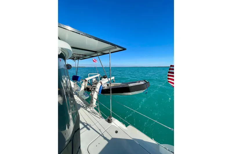 Slide: The Image of 2016 Lagoon 450 S catamaran on turquoise sea under clear blue sky. - 11