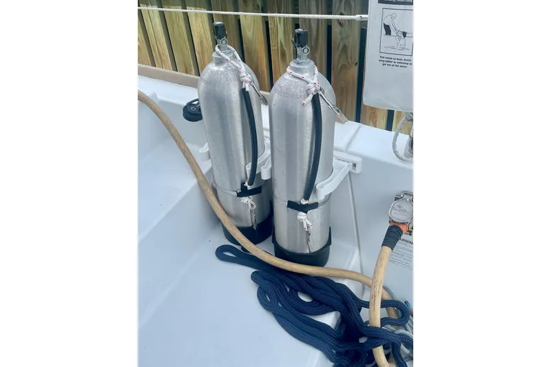 Slide: The Image of Two scuba tanks on a 2016 Lagoon 450 S yacht deck. - 14