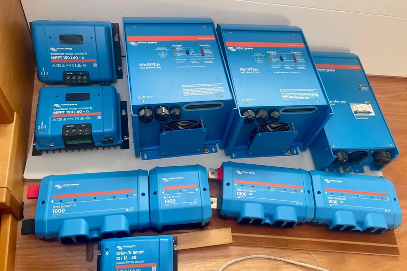 Slide: The Image of Victron Energy equipment on Lagoon 450 S catamaran, 2016 model, including charge controllers and inverters. - 15