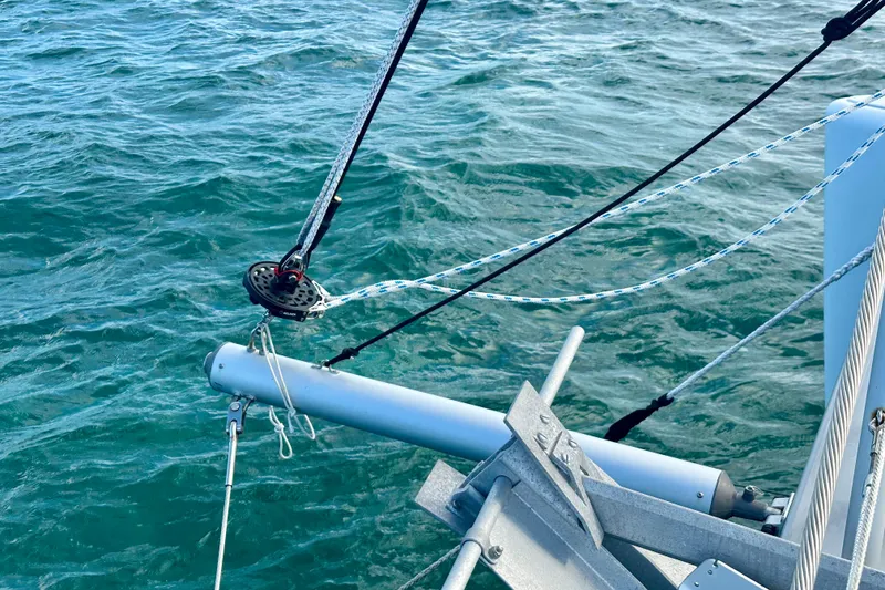 Slide: The Image of Sailing rigging on a 2016 Lagoon 450 S catamaran over turquoise water. - 21