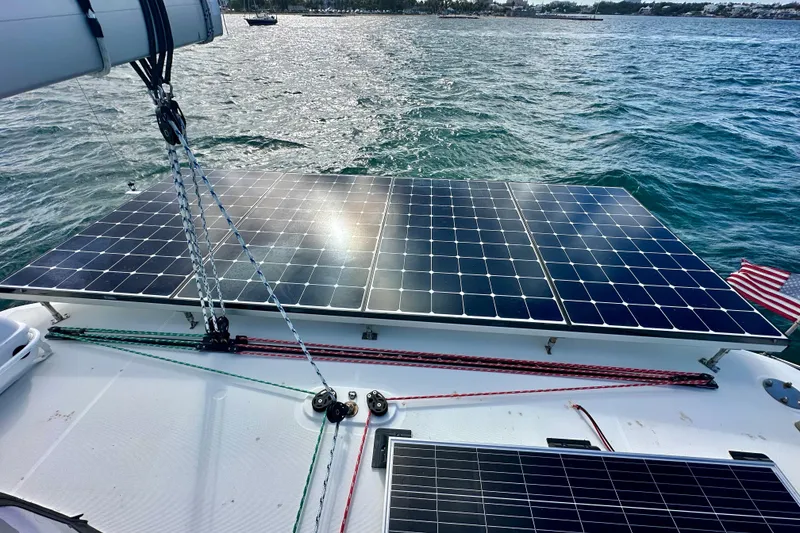 Slide: The Image of Solar panels on a 2016 Lagoon 450 S catamaran, harnessing energy on the ocean. - 27