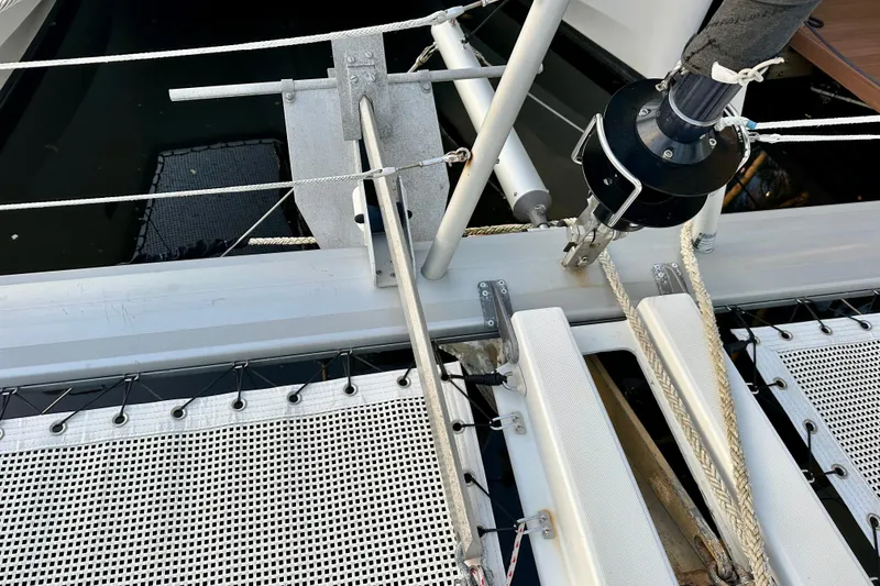 Slide: The Image of Close-up of 2016 Lagoon 450 S catamaran deck with rigging and netting. - 30