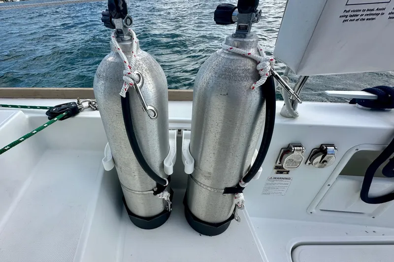 Slide: The Image of Two scuba tanks secured on a 2016 Lagoon 450 S catamaran deck. - 32