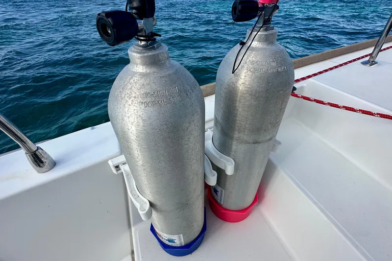 Slide: The Image of Two scuba tanks on a 2016 Lagoon 450 S catamaran deck. - 33